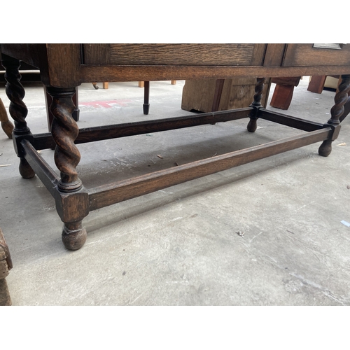 3164 - AN EARLY 20TH CENTURY OAK SIDEBOARD ON BARLEY TWIST LEGS 48