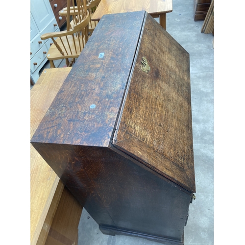 3169 - A GEORGE III OAK BUREAU WITH FITTED INTERIOR AND SEVEN DRAWERS TO BASE ON BRACKET FEET 36