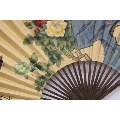 58 - A LARGE PAPER FAN WITH BIRD DECORATION, HEIGHT 98CM