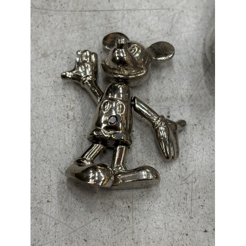 165A - THREE WHITE METAL FIGURES TO INCLUDE MICKEY MOUSE, A CAT AND A SWAN