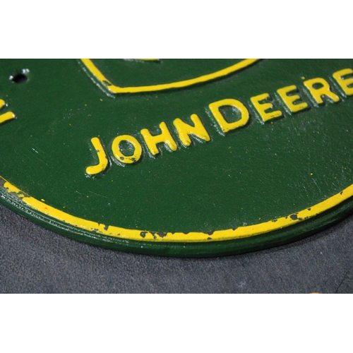 286 - A CAST JOHN DEERE SIGN, DIAMETER 23CM