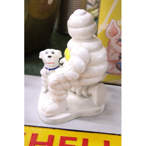 291A - A CAST MICHELIN MAN AND DOG, HEIGHT 20CM