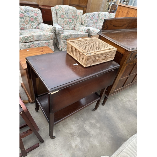 2957 - AN OAK TWO TIER DROP-LEAF TROLLEY AND WICKER BASKET