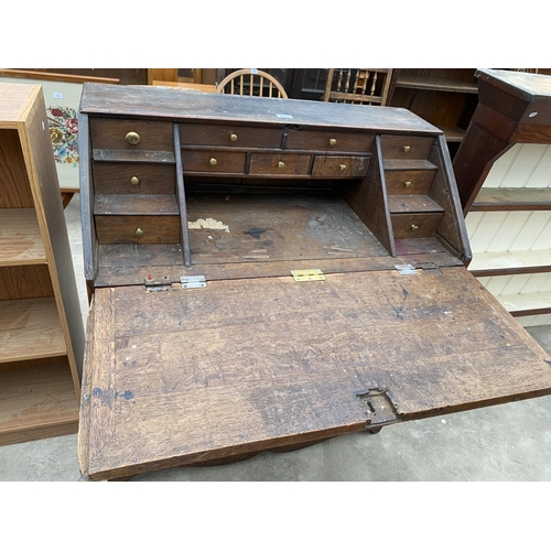 2973 - AN OAK GEORGE III BUREAU WITH FITTED INTERIOR AND THREE DRAWERS TO BASE, 37