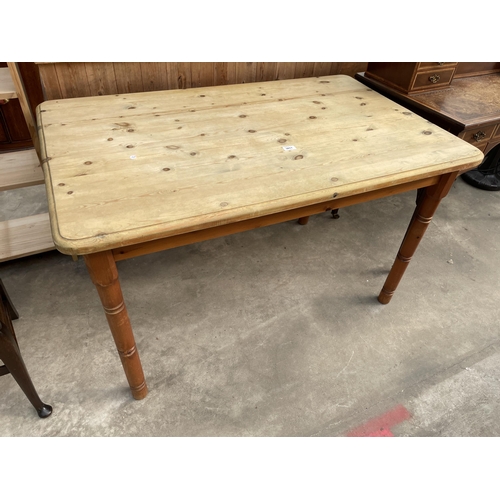 3011 - A PINE KITCHEN TABLE ON TURNED LEGS, 48