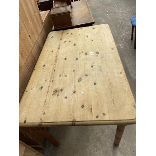 3011 - A PINE KITCHEN TABLE ON TURNED LEGS, 48