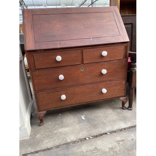 3021 - A MAHOGANY BUREAU WITH THREE DRAWERS HAVING PORCELAIN KNOBS, 36