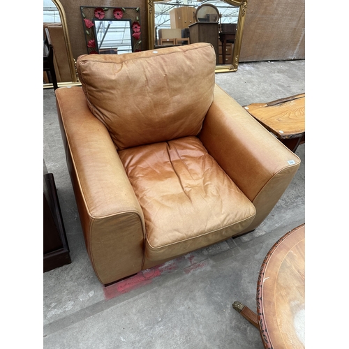 3101 - A TAN LEATHER ARMCHAIR