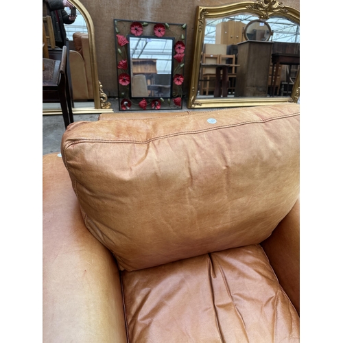 3101 - A TAN LEATHER ARMCHAIR