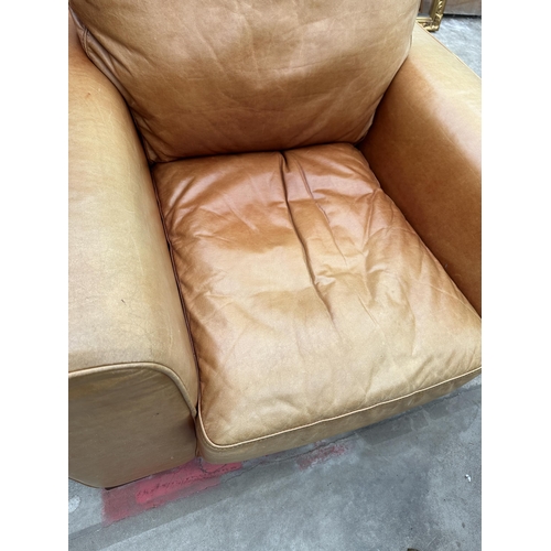 3101 - A TAN LEATHER ARMCHAIR