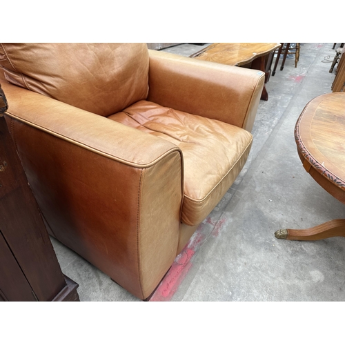 3101 - A TAN LEATHER ARMCHAIR