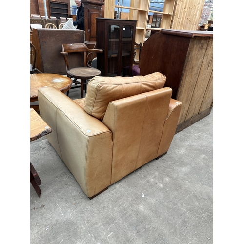 3101 - A TAN LEATHER ARMCHAIR