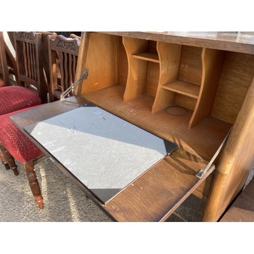 3142 - A MID 20TH CENTURY OAK BUREAU, 30