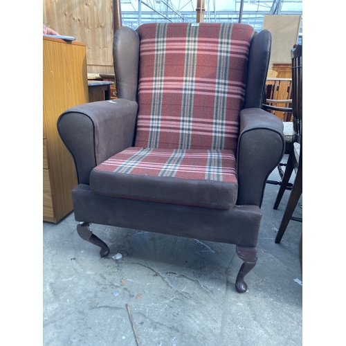 3155 - A FAUX LEATHER AND TARTAN WINGED FIRESIDE CHAIR ON CABRIOLE LEGS