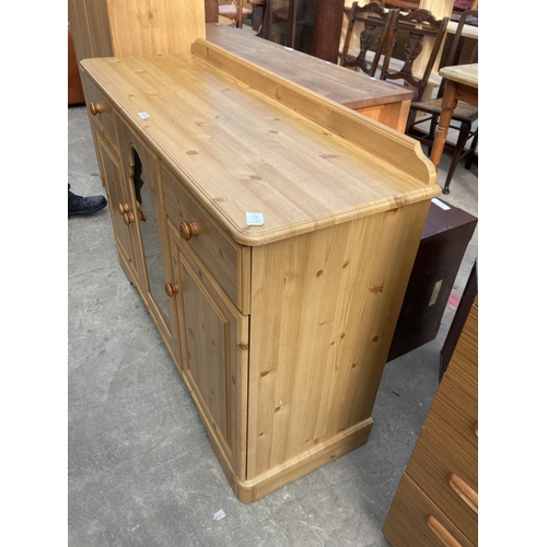 3157 - A PINE SIDEBOARD WITH GLAZED CENTRAL DOOR, 48.5