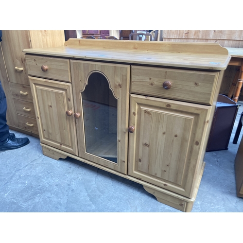 3157 - A PINE SIDEBOARD WITH GLAZED CENTRAL DOOR, 48.5