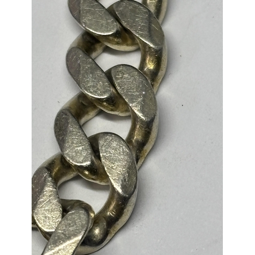  A MARKED SILVER HEAVY CURB LINK WRIST CHAIN