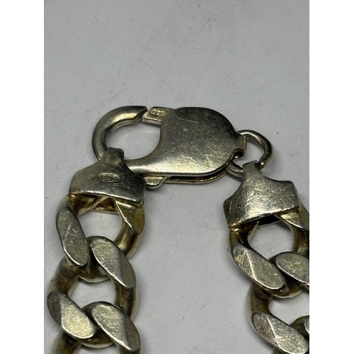  A MARKED SILVER HEAVY CURB LINK WRIST CHAIN