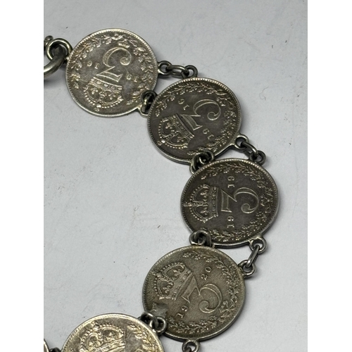  A SILVER BRACELET WITH NINE SILVER JOEYS