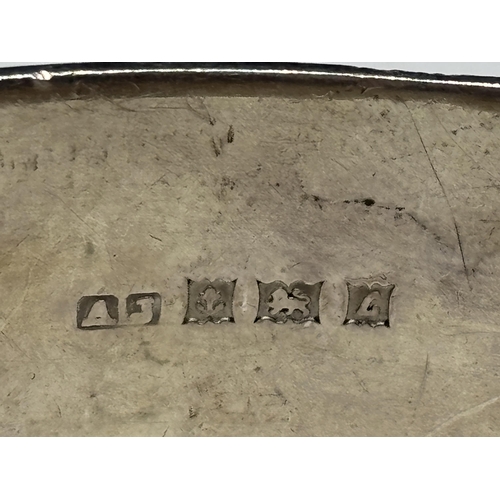  A HEAVY DECORATIVE HALLMARKED BIRMINGHAM SILVER BANGLE