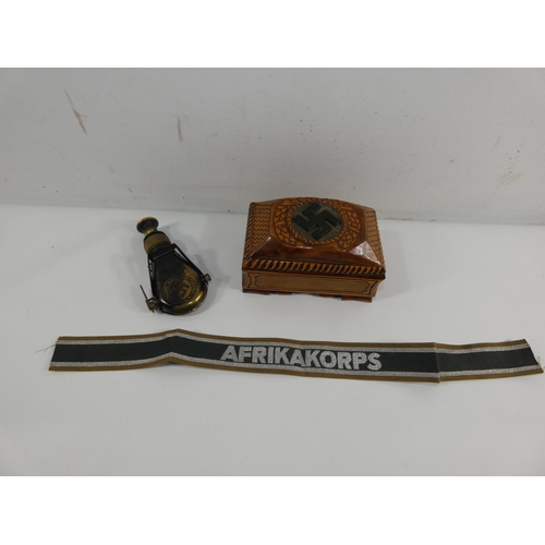 316 - A WOODEN BOX WITH CARVED SWASTIKA DECORATION, AFRIKA KORPS BAND AND A FOLDING MONOCULAR