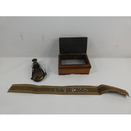 316 - A WOODEN BOX WITH CARVED SWASTIKA DECORATION, AFRIKA KORPS BAND AND A FOLDING MONOCULAR