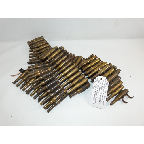 323 - A 7.62MM X 51MM FIRED BLANK BELT OF ONE HUNDRED CARTRIDGES WITH PROVENANCE