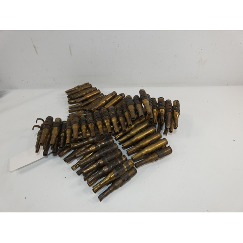 323 - A 7.62MM X 51MM FIRED BLANK BELT OF ONE HUNDRED CARTRIDGES WITH PROVENANCE