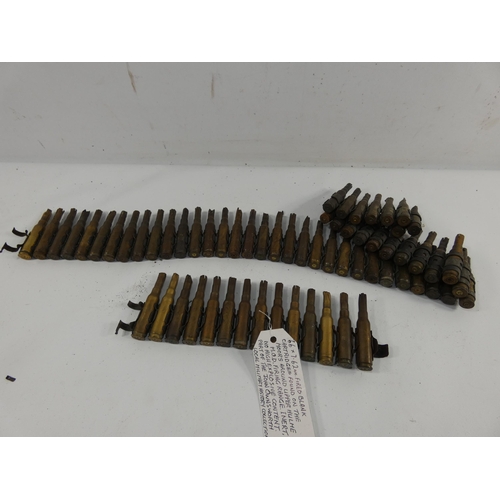 325 - A 7.62MM FIRED BLANK BELT OF SIXTY SIX CARTRIDGES WITH PROVENANCE