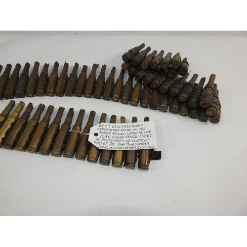 325 - A 7.62MM FIRED BLANK BELT OF SIXTY SIX CARTRIDGES WITH PROVENANCE