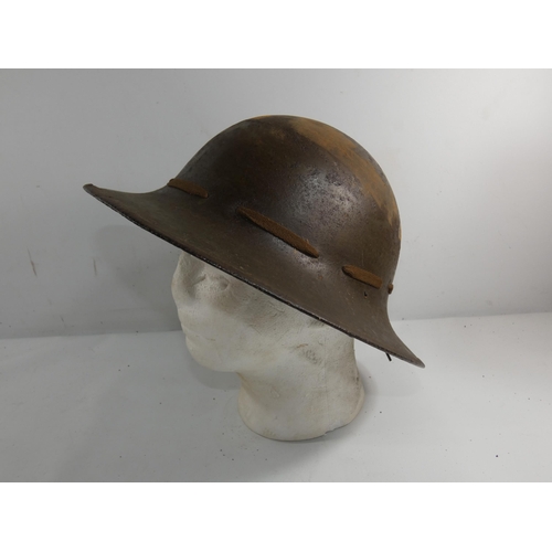 333 - A WORKD WAR II BRITISH ZUKERMAN PAINTED METAL HELMET AND LINER