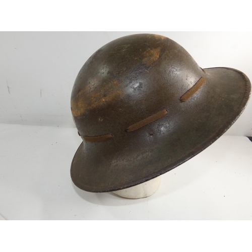 333 - A WORKD WAR II BRITISH ZUKERMAN PAINTED METAL HELMET AND LINER