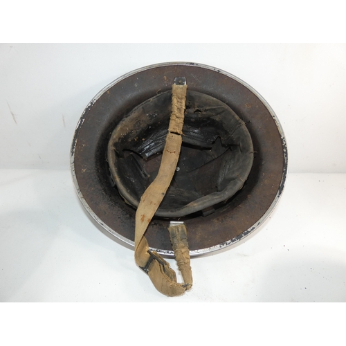 334 - A WORLD WAR II BRITISH PAINTED METAL HELMET AND LINER