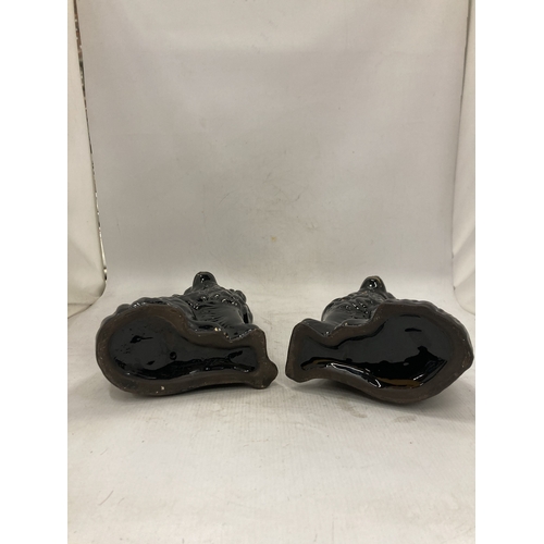 101 - A PAIR OF BLACK STAFFORDSHIRE JACKFIELD STYLE SPANIEL FIGURES - 24.5 CM