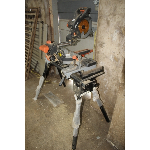 31 - AN EVOLUTION MITRE CHOP SAW ON STAND  + VAT