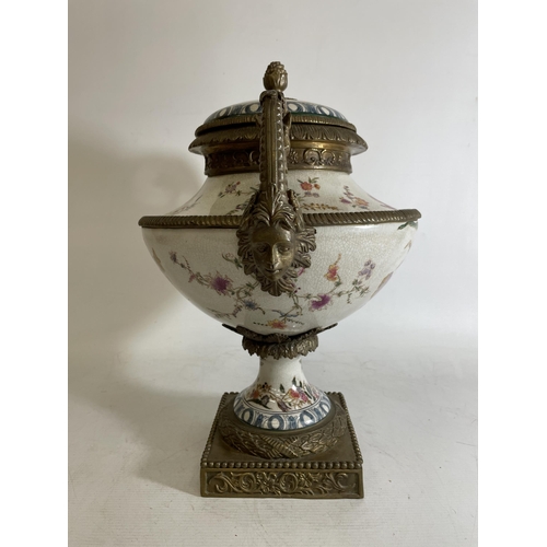 1 - A LARGE PORCELAIN URN WITH BRONZE ACCENTS, POSSIBLY CHINESE.  FEATURING A FLORAL DESIGN WITH ANIMAL ... 