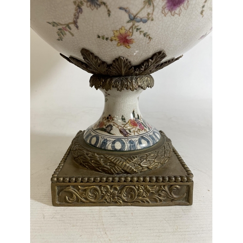 1 - A LARGE PORCELAIN URN WITH BRONZE ACCENTS, POSSIBLY CHINESE.  FEATURING A FLORAL DESIGN WITH ANIMAL ... 