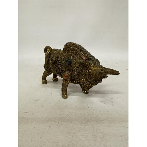 14 - A TIBETAN BRASS FILIGREE MODEL OF A BULL WITH INLAID SEMI PRECIOUS STONES, HEIGHT 13CM, LENGTH 21CM