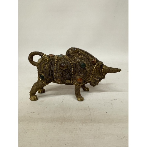 14 - A TIBETAN BRASS FILIGREE MODEL OF A BULL WITH INLAID SEMI PRECIOUS STONES, HEIGHT 13CM, LENGTH 21CM