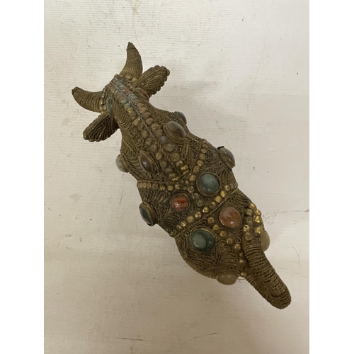 14 - A TIBETAN BRASS FILIGREE MODEL OF A BULL WITH INLAID SEMI PRECIOUS STONES, HEIGHT 13CM, LENGTH 21CM