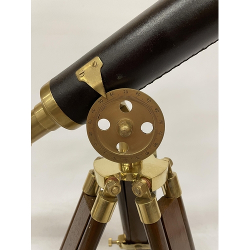 18 - A WOOD AND BRASS TELESCOPE WITH SIGHTS AND TRIPOD LEGS