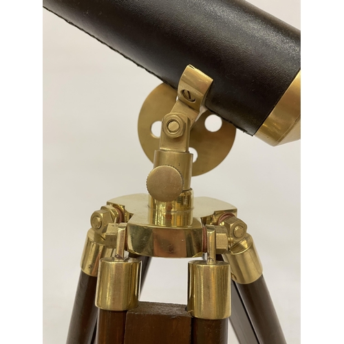 18 - A WOOD AND BRASS TELESCOPE WITH SIGHTS AND TRIPOD LEGS