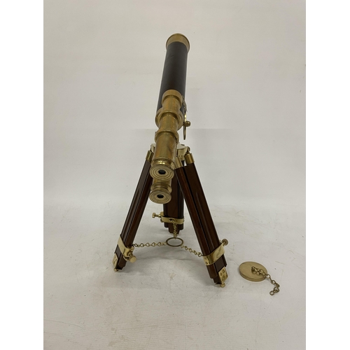 18 - A WOOD AND BRASS TELESCOPE WITH SIGHTS AND TRIPOD LEGS