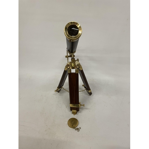 18 - A WOOD AND BRASS TELESCOPE WITH SIGHTS AND TRIPOD LEGS