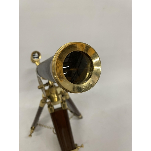 18 - A WOOD AND BRASS TELESCOPE WITH SIGHTS AND TRIPOD LEGS