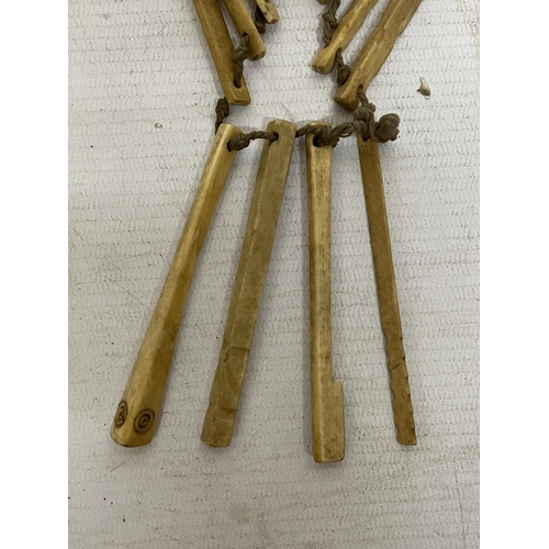 23 - A GROUP OF 19TH CENTURY CARVED BONE INSTRUMENTS TO INCLUDE A HAMMER, CRICKET BAT, ETC, APPROX 9CM LO... 