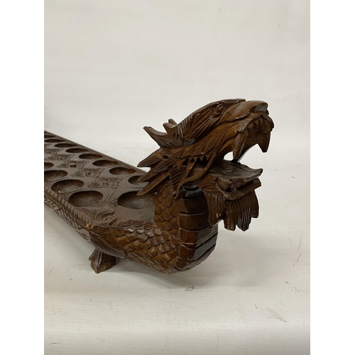 26 - A VINTAGE HARDWOOD ORIENTAL DRAGON SHAPED 'MONCALA' COUNT AND CATCH GAME (NO COUNTERS) - LENGTH 89CM