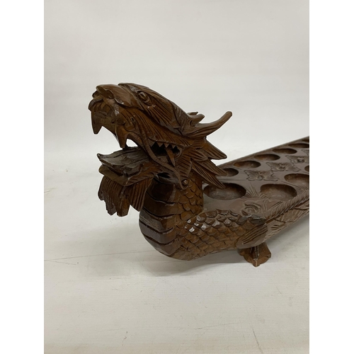 26 - A VINTAGE HARDWOOD ORIENTAL DRAGON SHAPED 'MONCALA' COUNT AND CATCH GAME (NO COUNTERS) - LENGTH 89CM