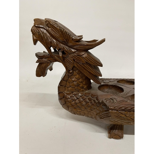 26 - A VINTAGE HARDWOOD ORIENTAL DRAGON SHAPED 'MONCALA' COUNT AND CATCH GAME (NO COUNTERS) - LENGTH 89CM