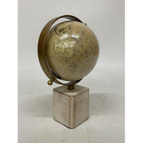 40 - A WORLD GLOBE ON A WOODEN BASE, HEIGHT 25CM